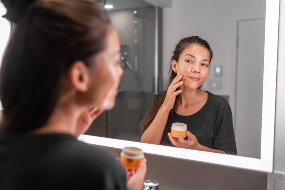 Woman using facial peeling product