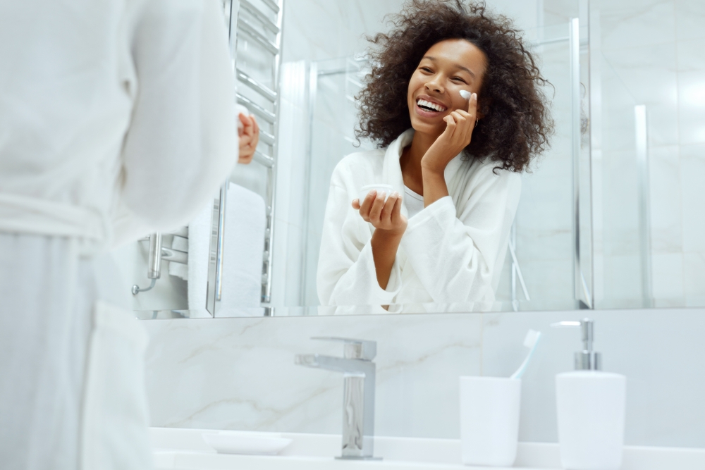 Woman applying face cream