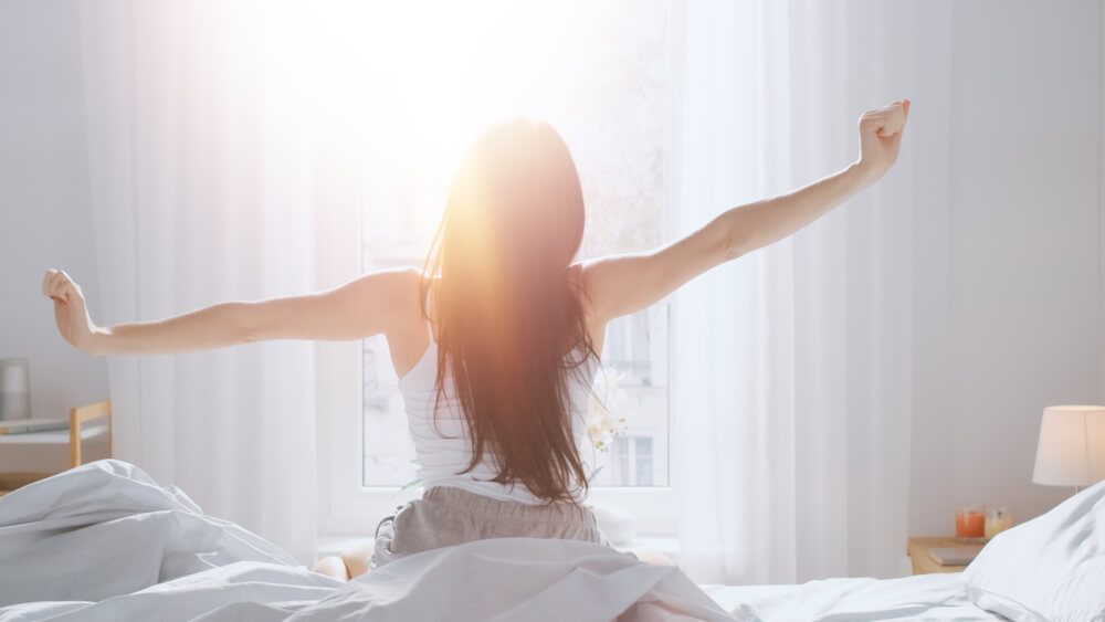 Woman waking up in morning