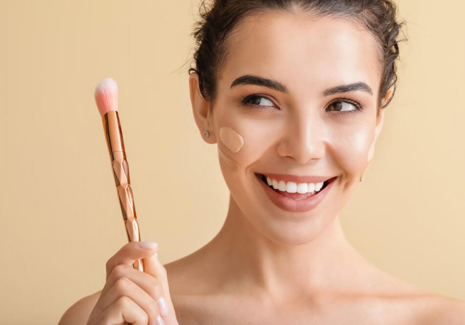 woman applying makeup