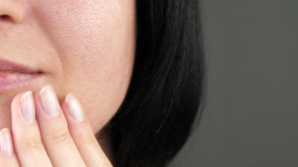 woman touching face closeup