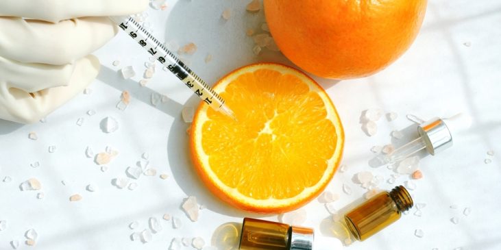 Syringe in orange slice