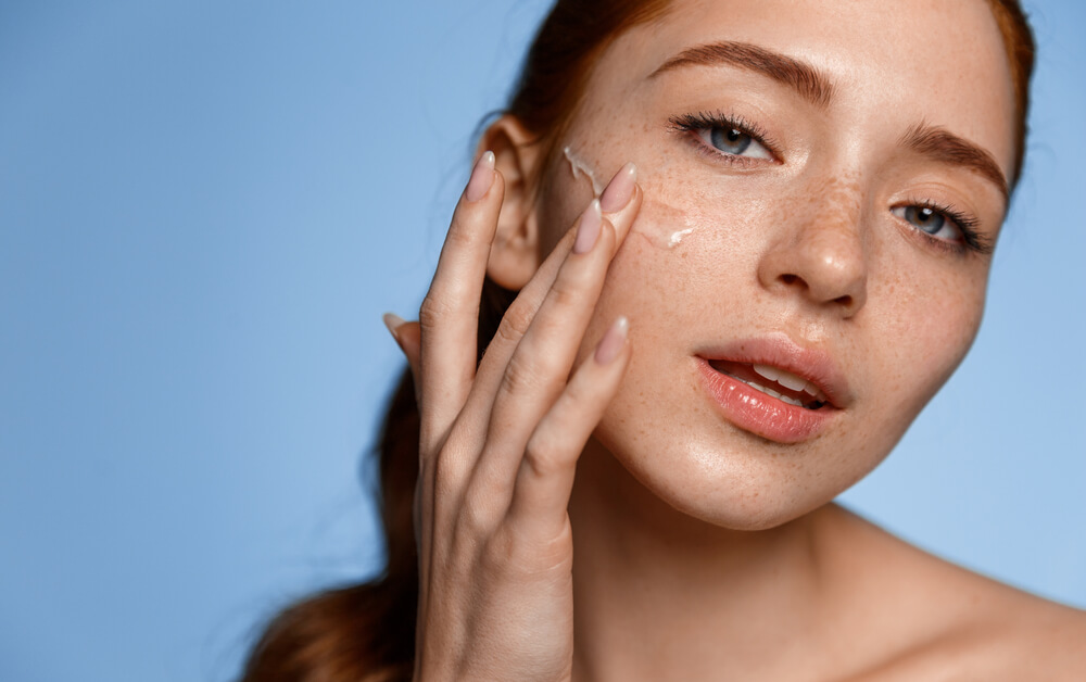 woman applying serum