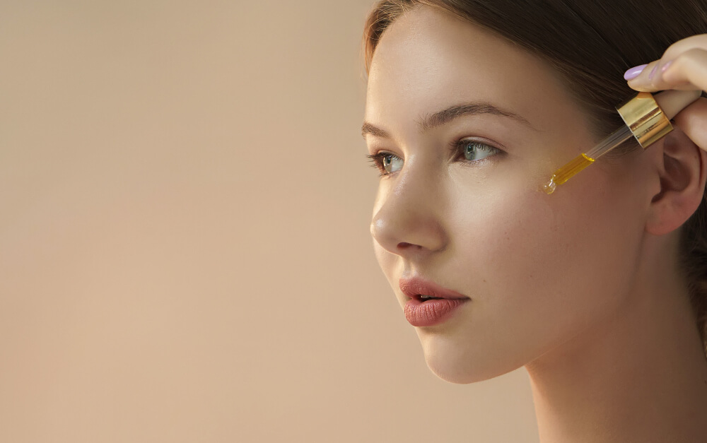 woman applying serum